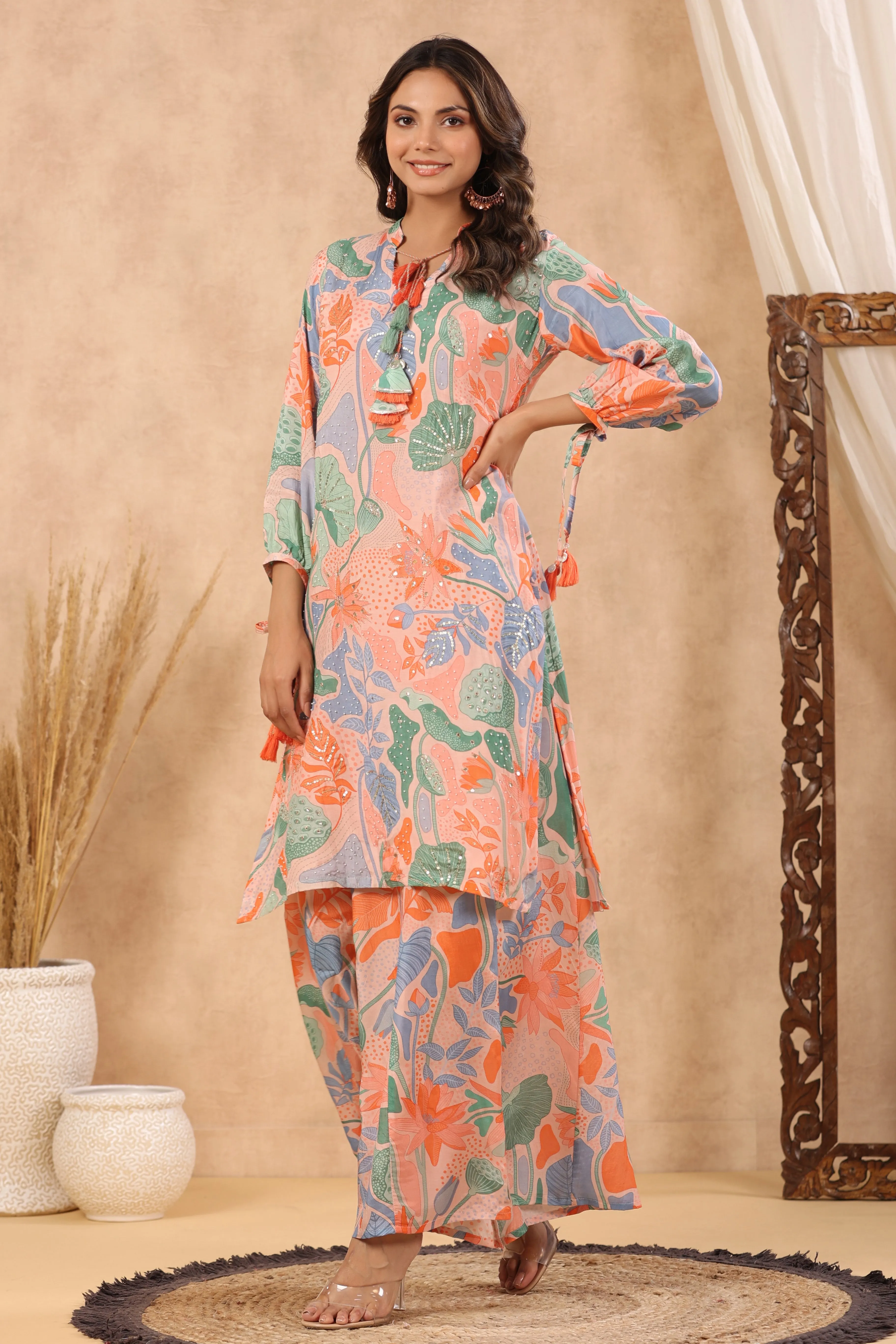Multi coloured peach base abstract print kurta with palazzo set with pearl gota and sequins work
