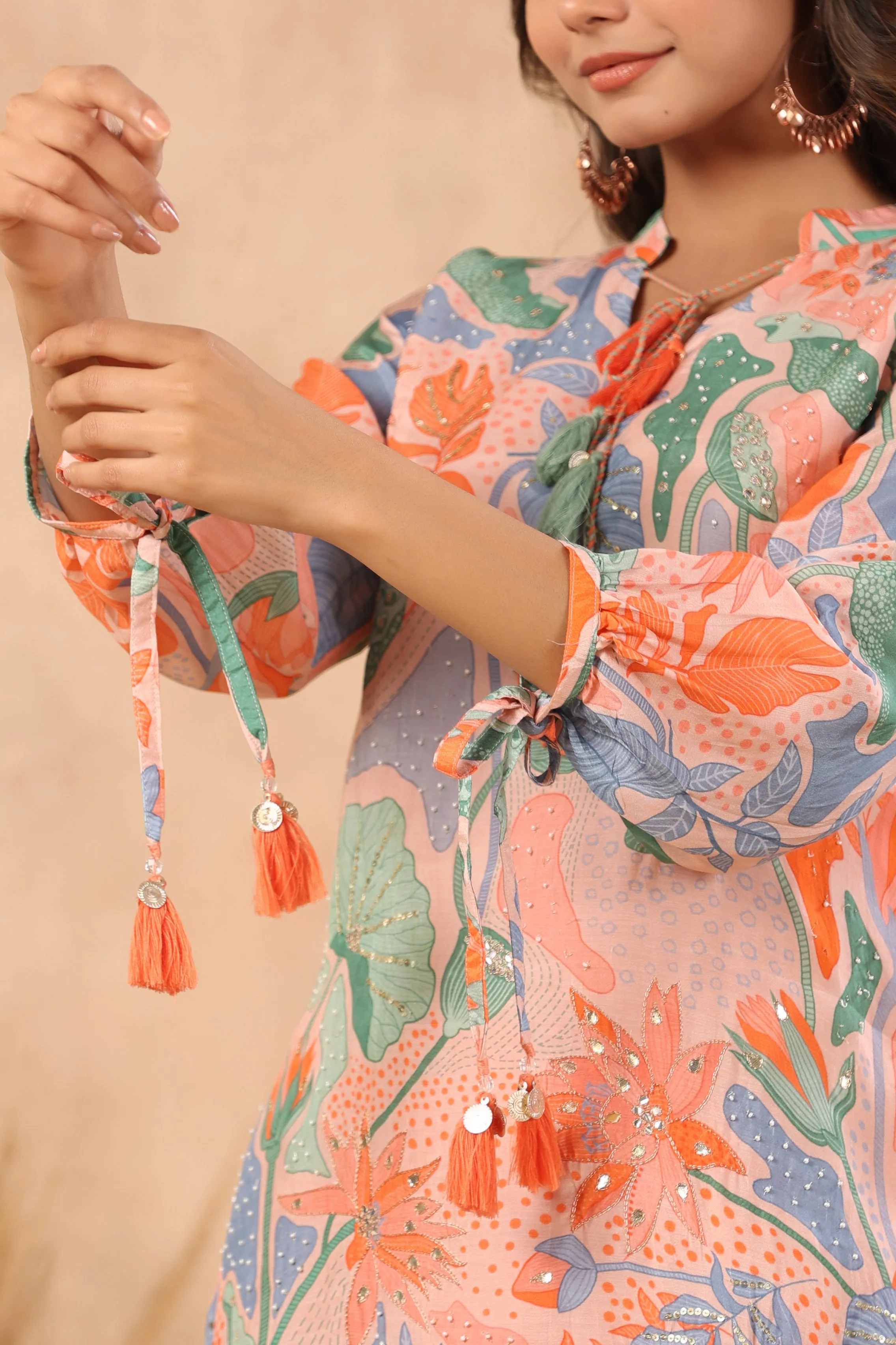Multi coloured peach base abstract print kurta with palazzo set with pearl gota and sequins work