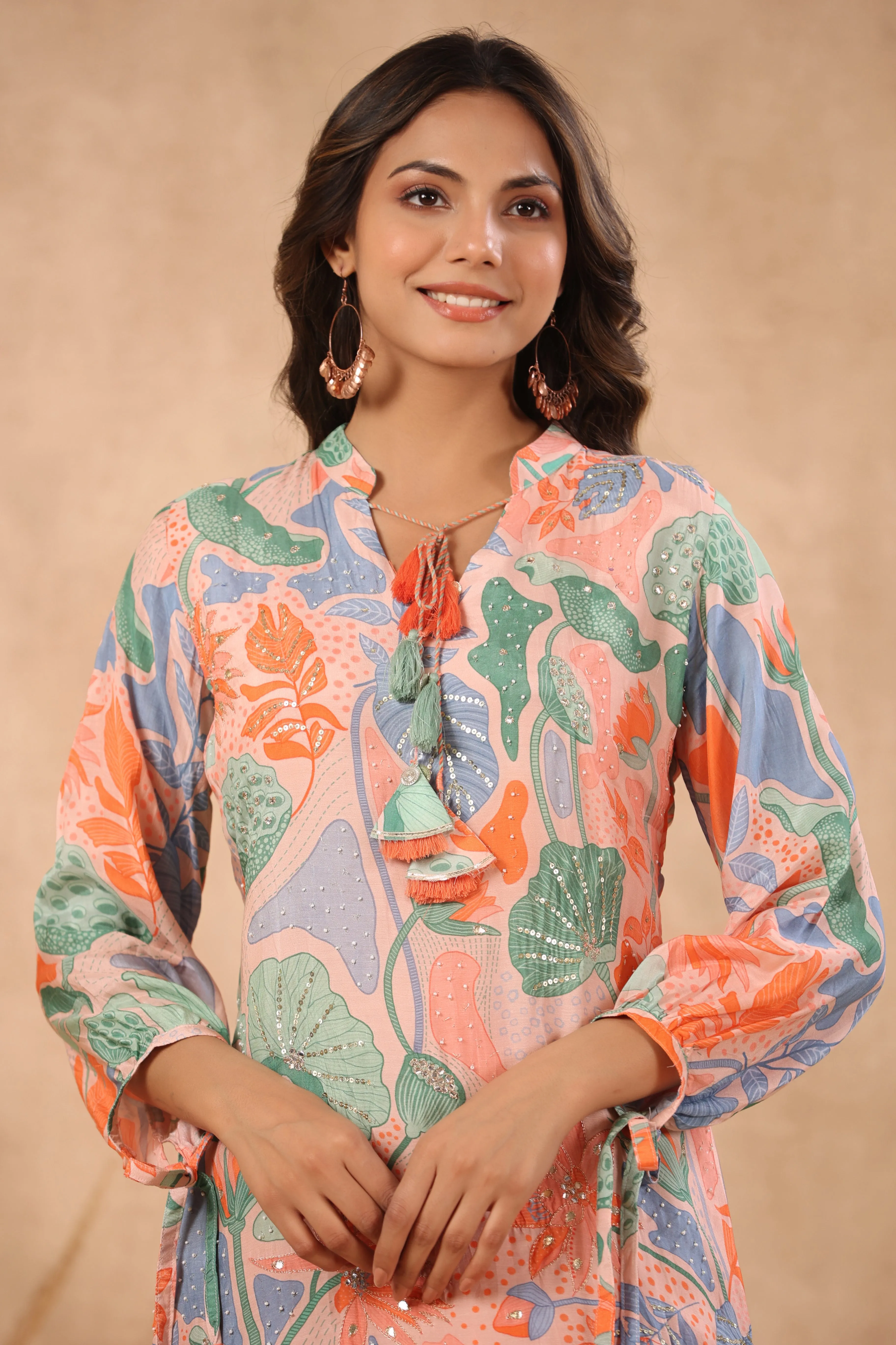 Multi coloured peach base abstract print kurta with palazzo set with pearl gota and sequins work